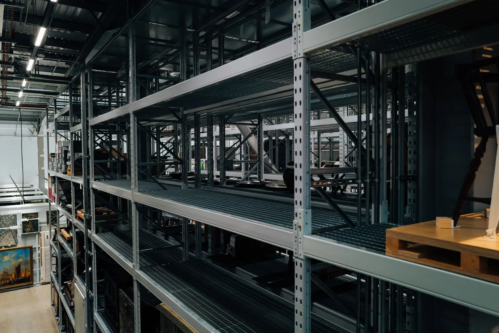 The interior of an industrial warehouse with metal racking