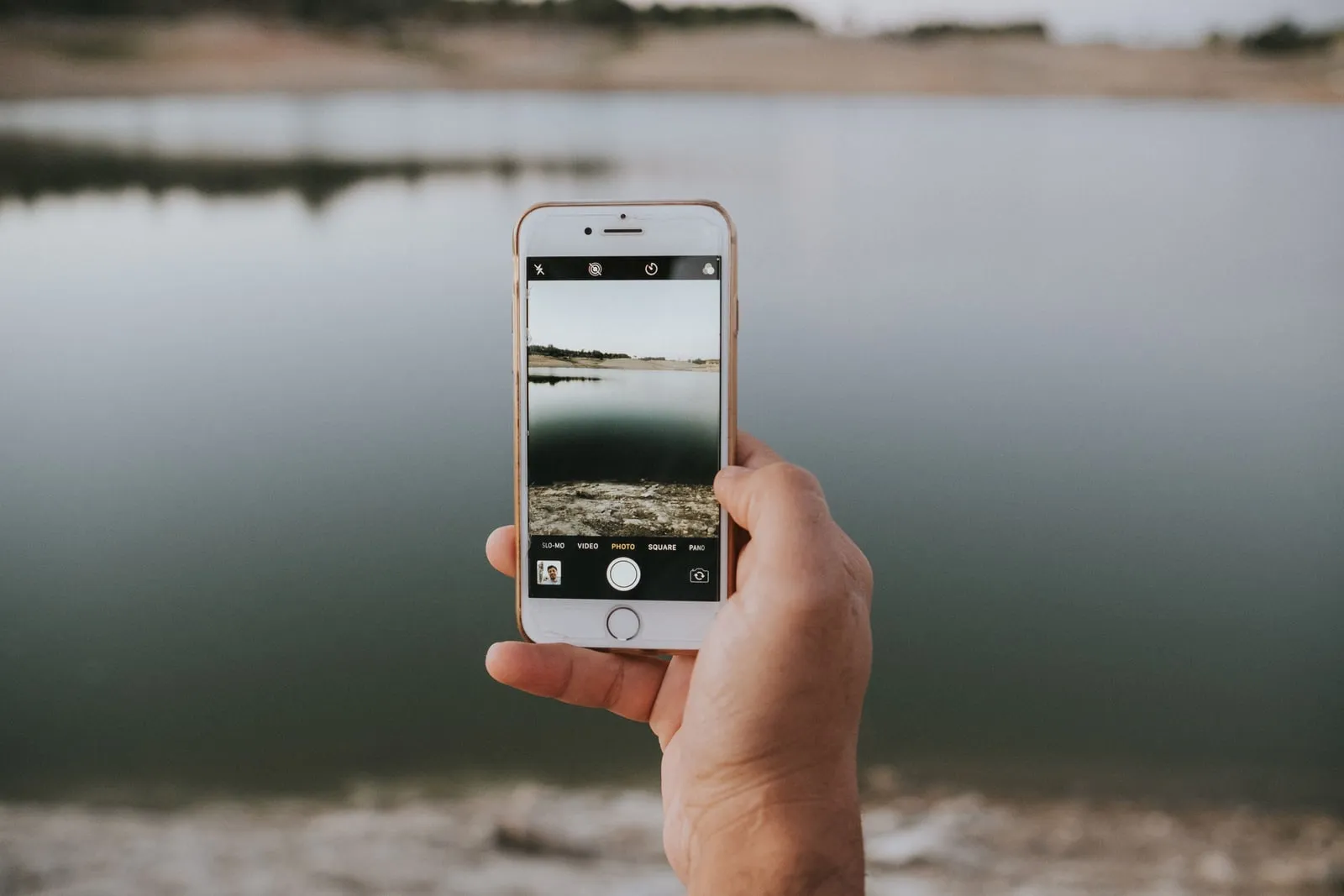 A person taking a photo with a smartphone