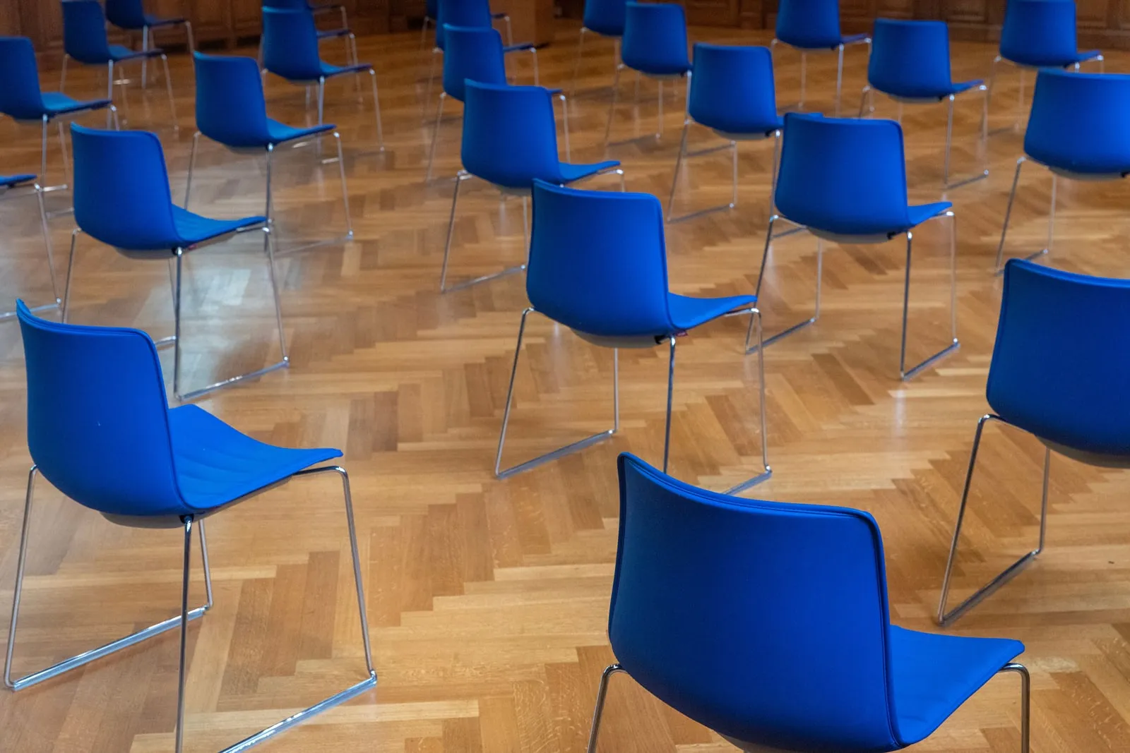 Rows of chairs set out in a conference room