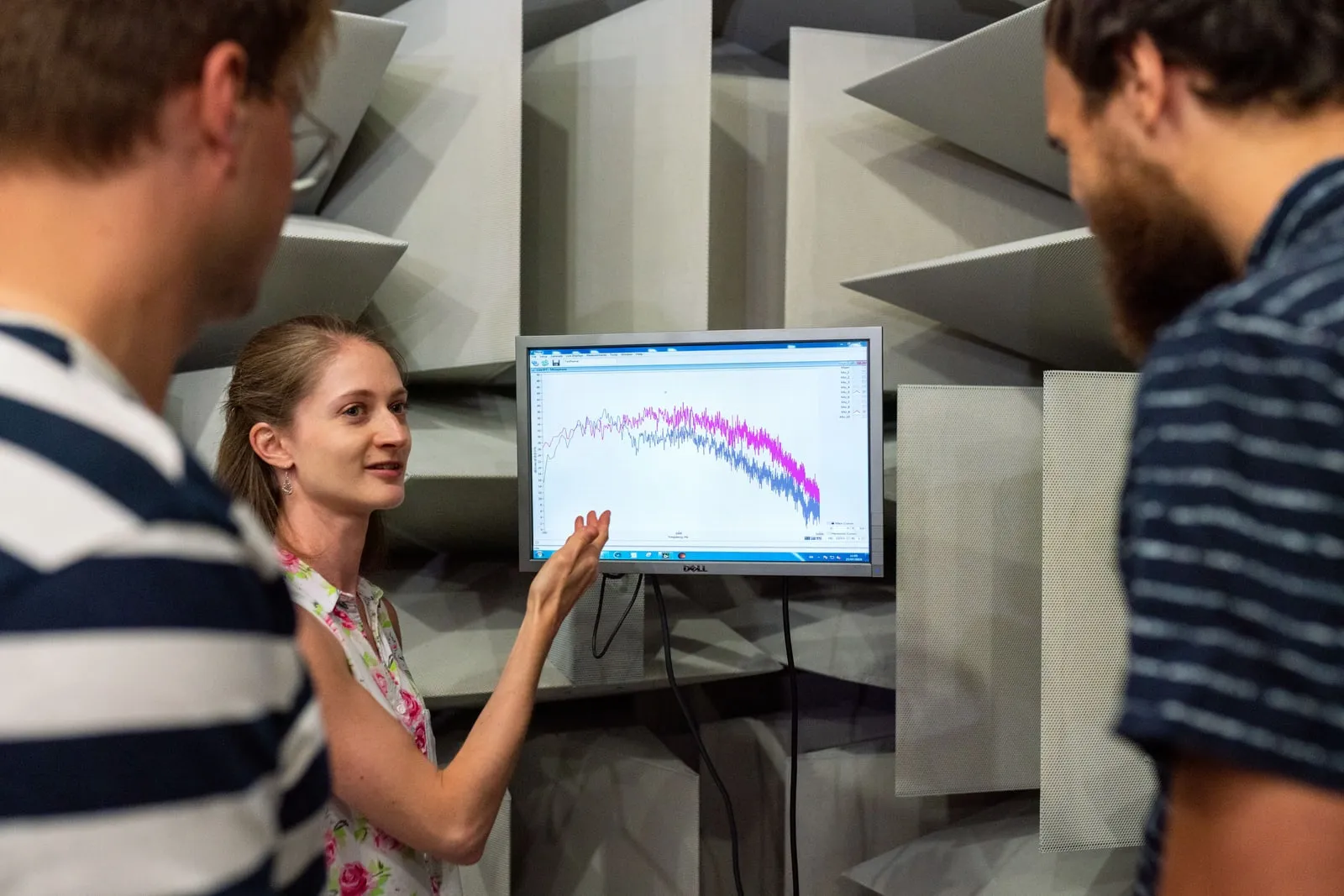 Engineers reviewing test results on a monitor