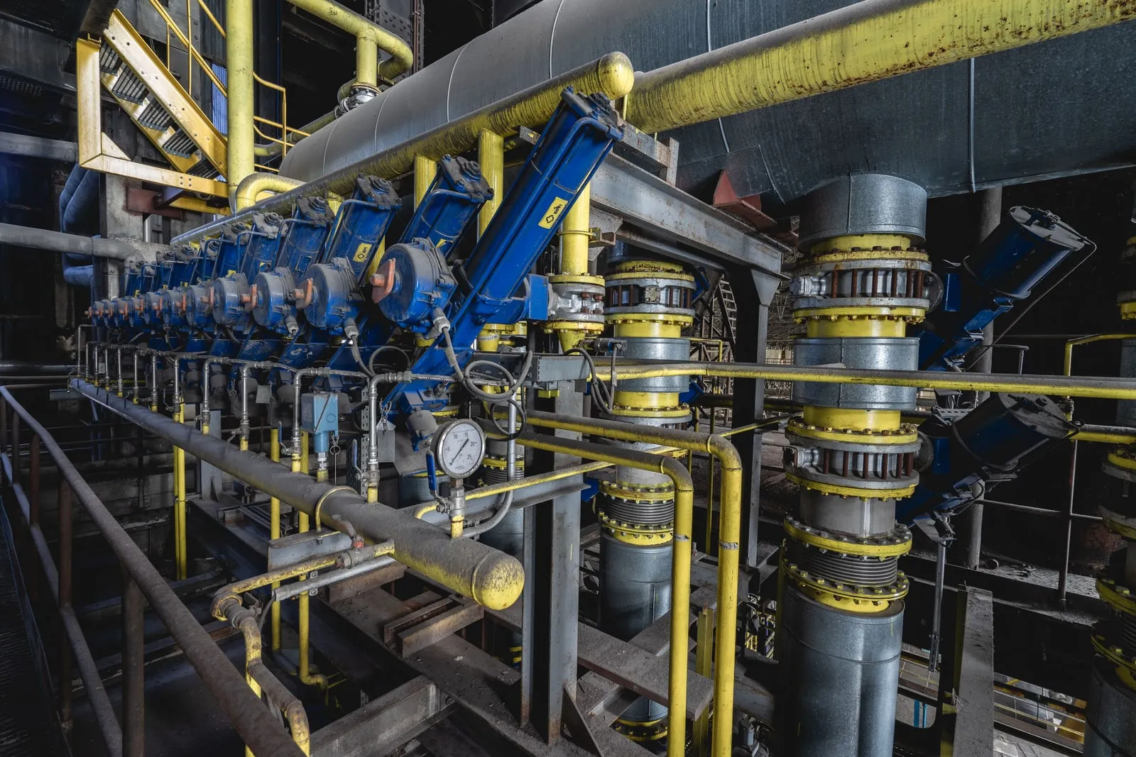 Large metal pipes running through an industrial hall