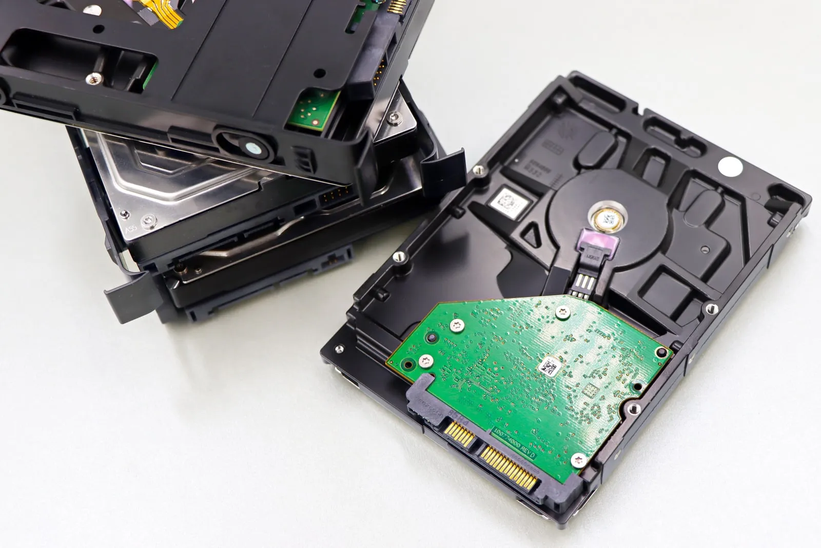Hard disk drives laid out on a light work surface