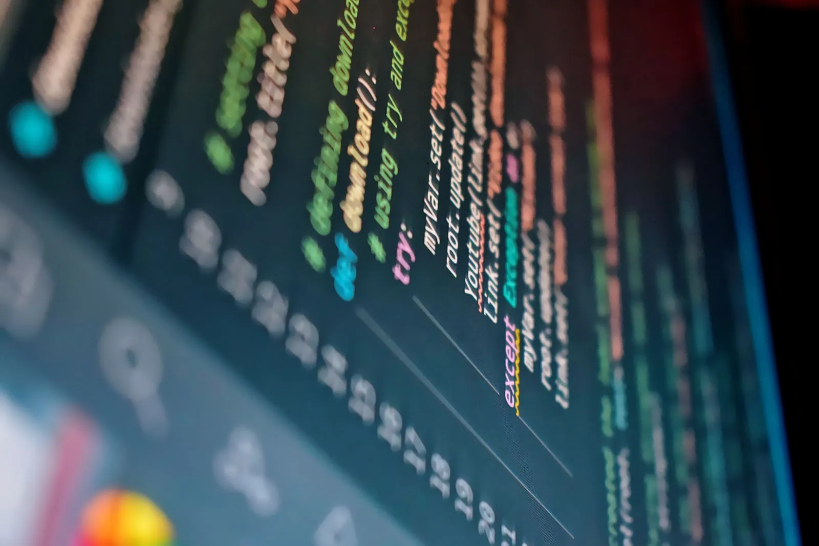 A developer terminal window with code on a monitor