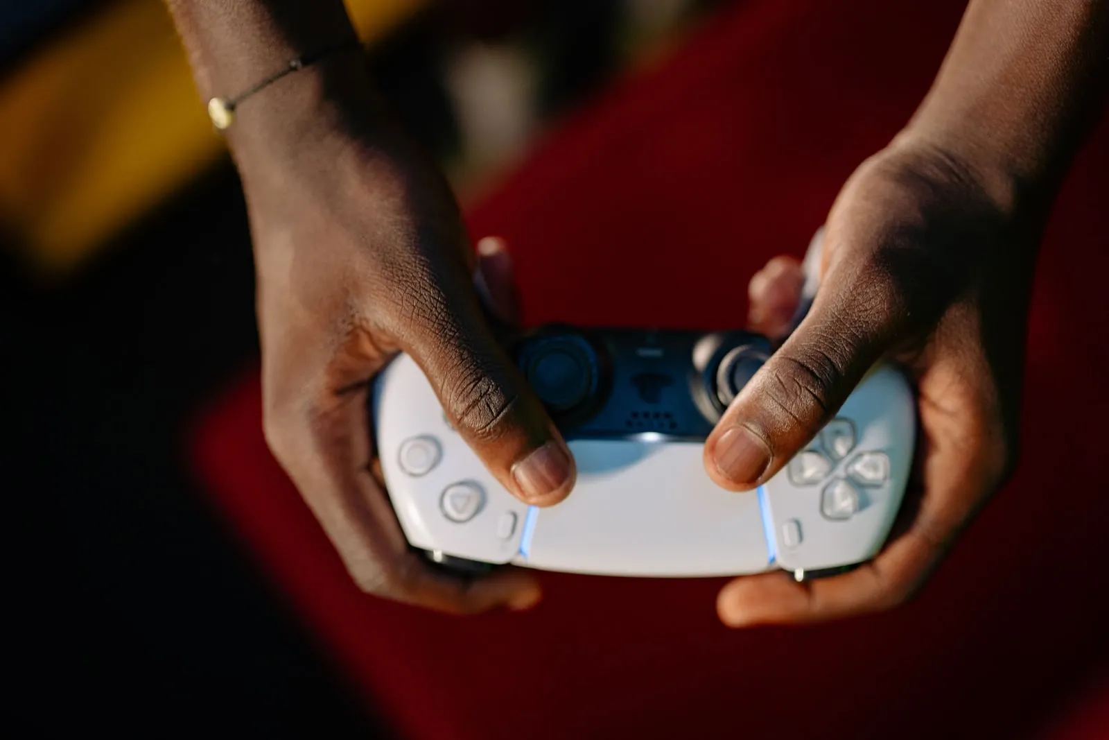 Hands holding a video game controller