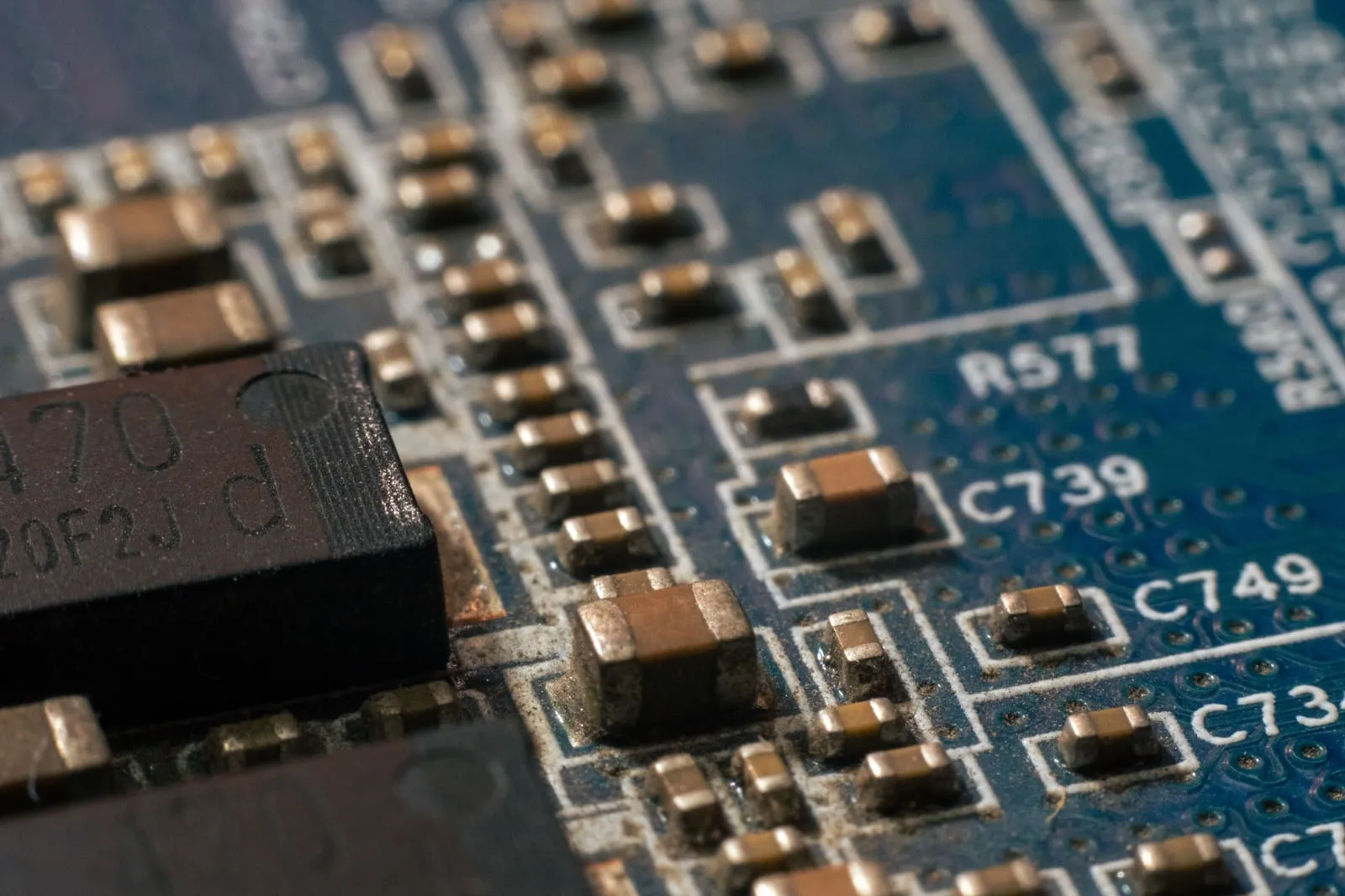 A close-up of a green printed circuit board