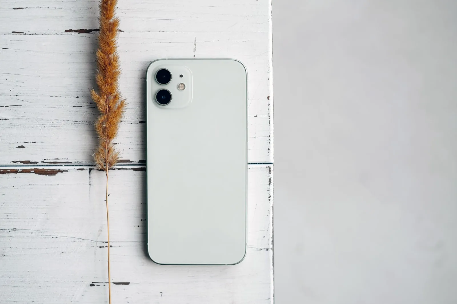 A smartphone lying on a wooden table