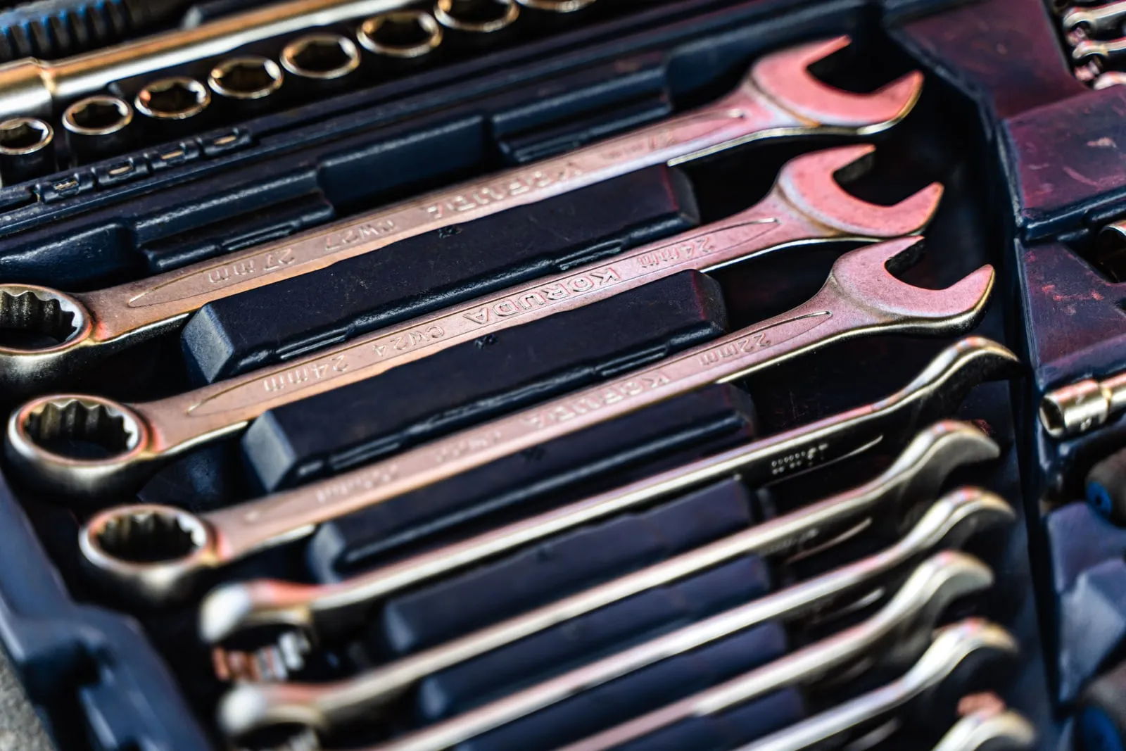 A mechanic's toolbox with wrenches
