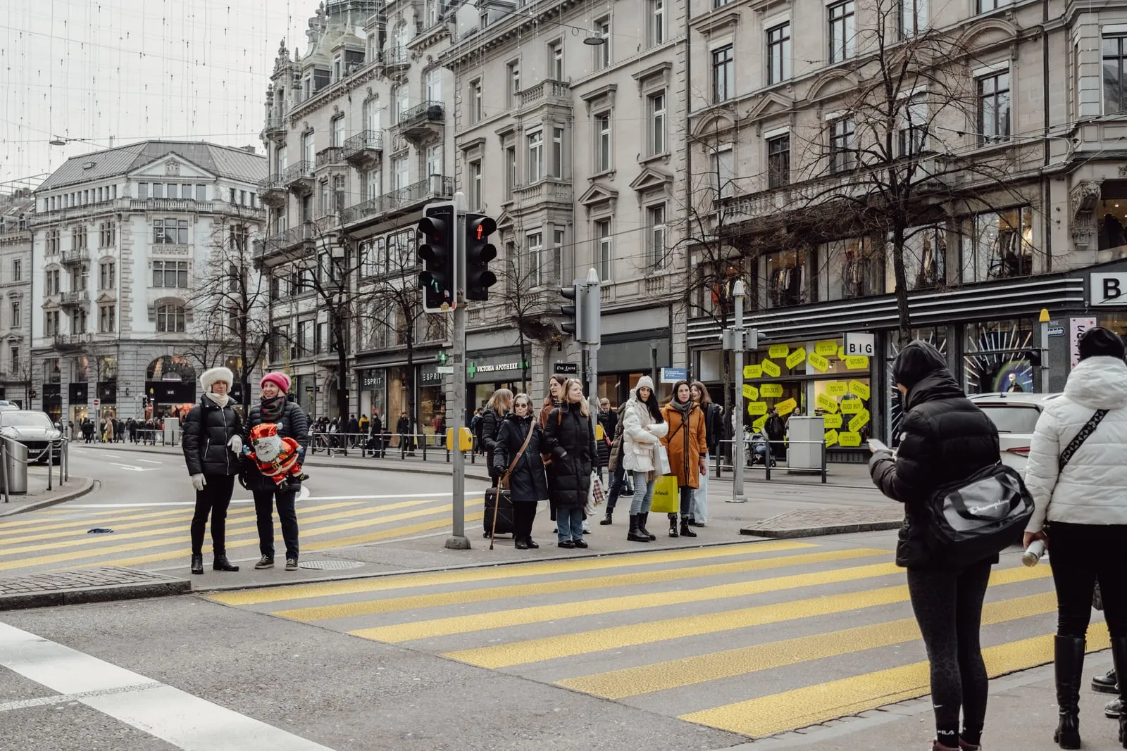 Pedestrians crossing a busy city street