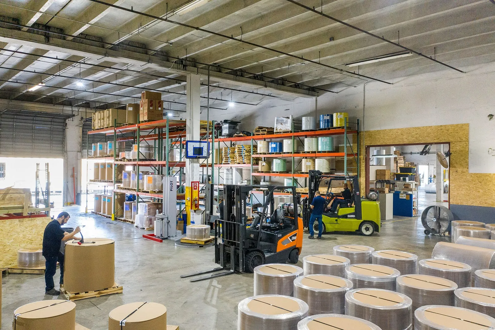 A warehouse forklift moving pallets