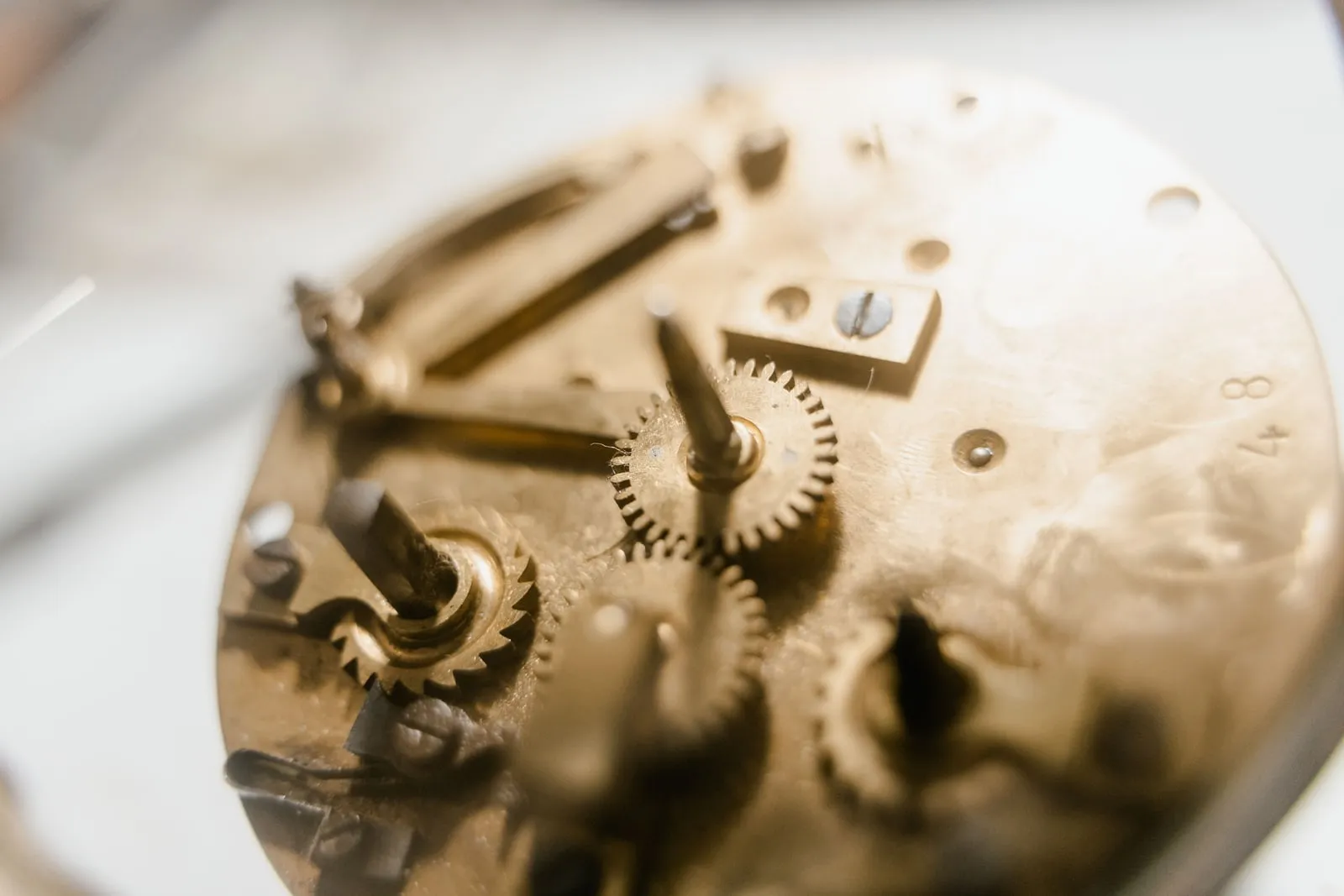 Close-up of the brass gears inside an antique watch movement