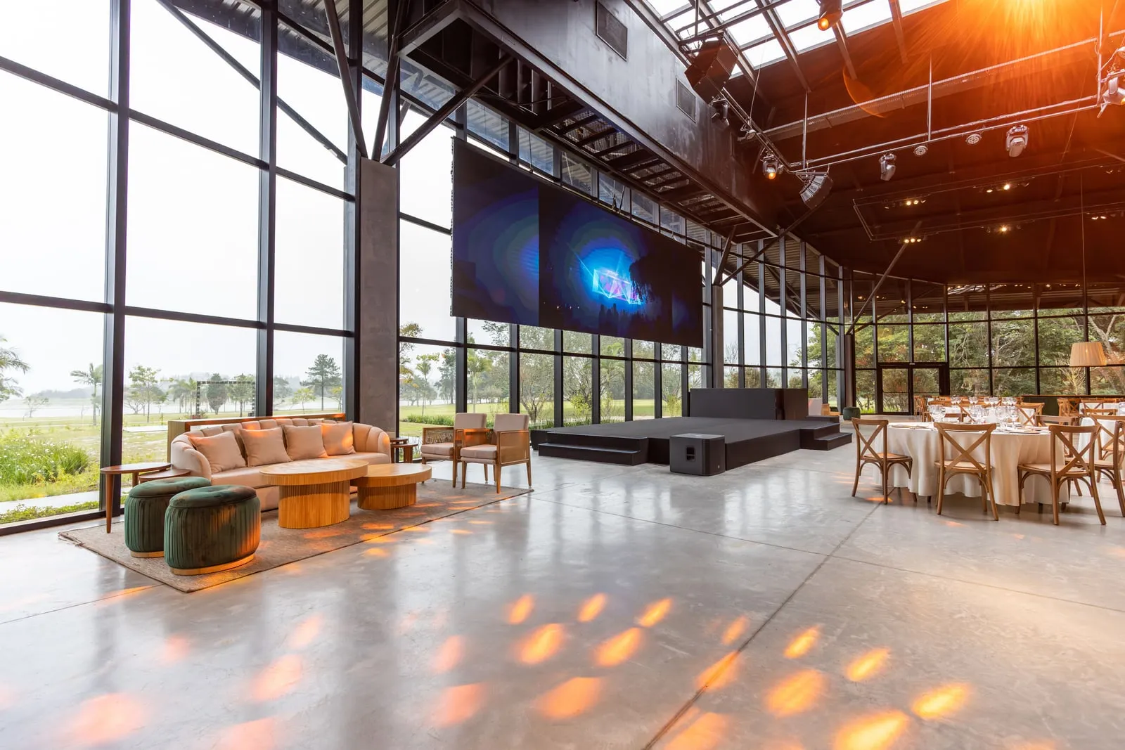 A conference stage with a large screen