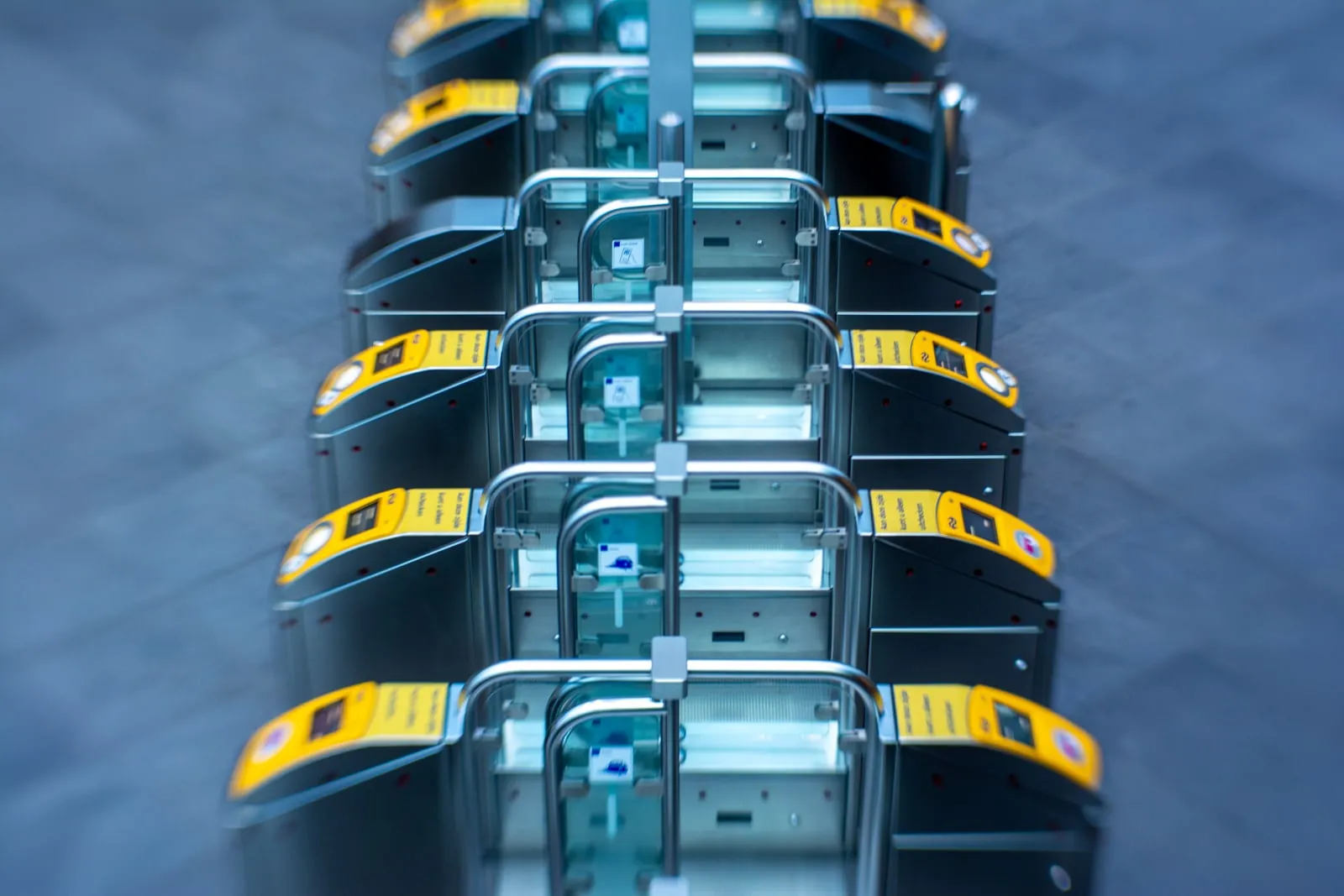 A row of access-control gates with card readers