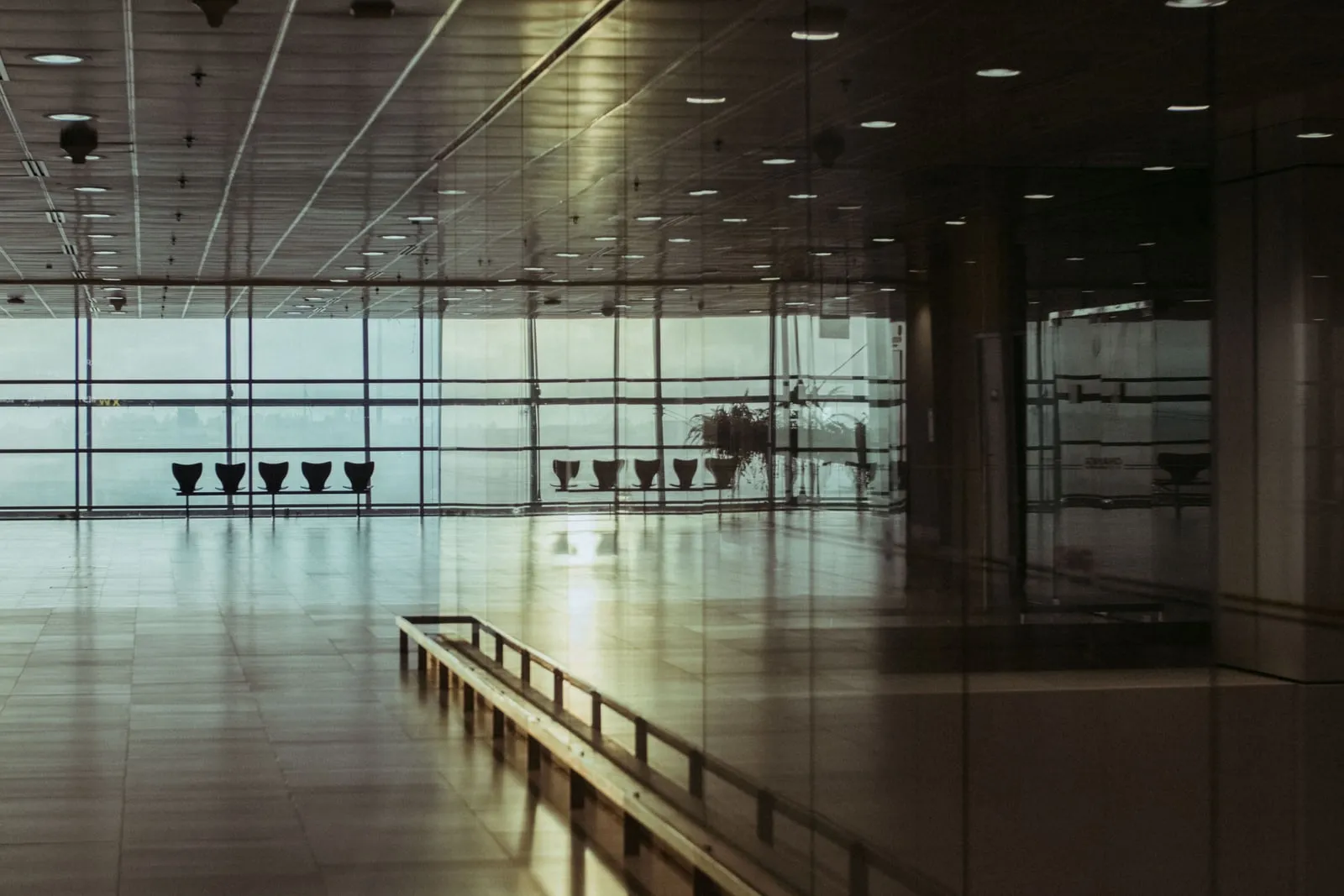 An empty row of seats in an airport terminal