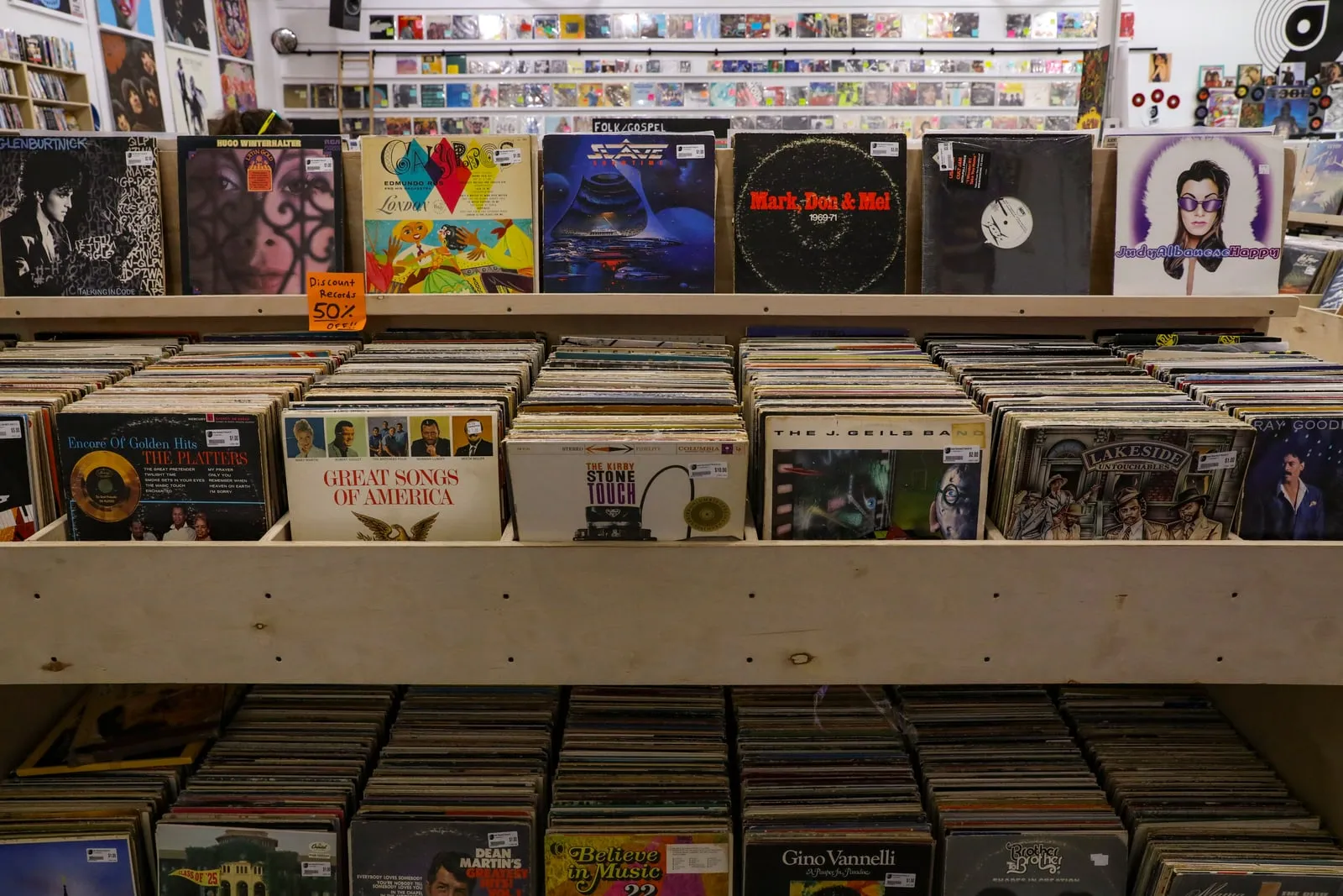 Vinyl records stacked in a record shop