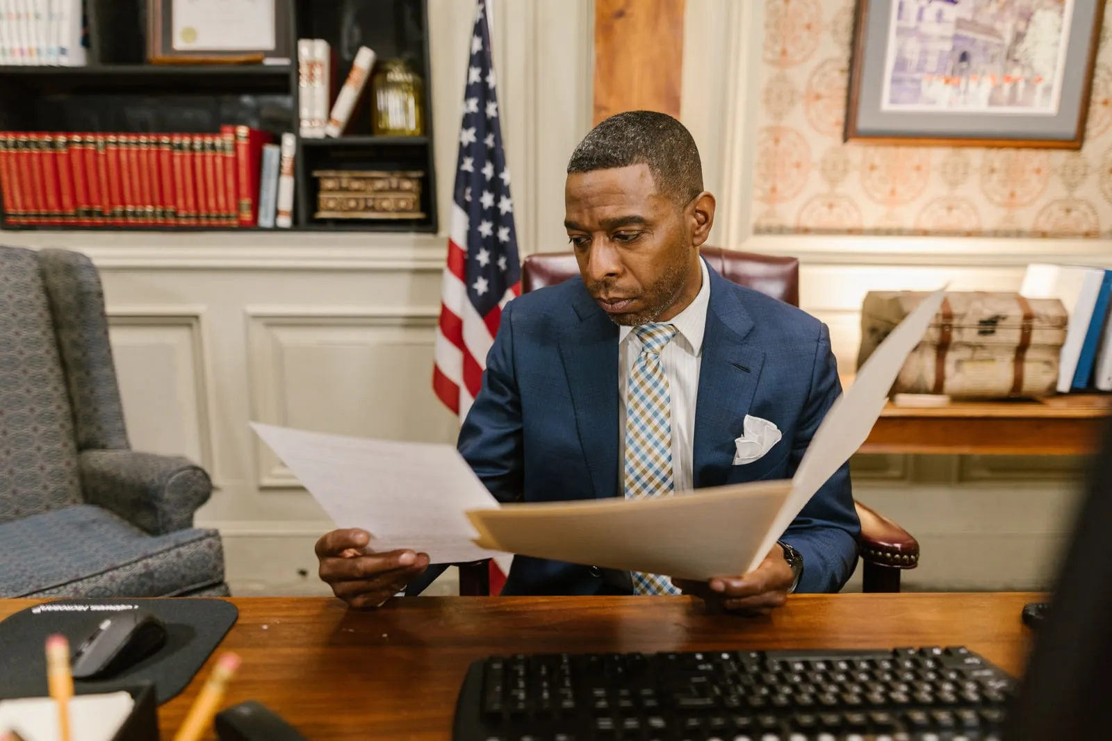 A lawyer reading documents in a law library