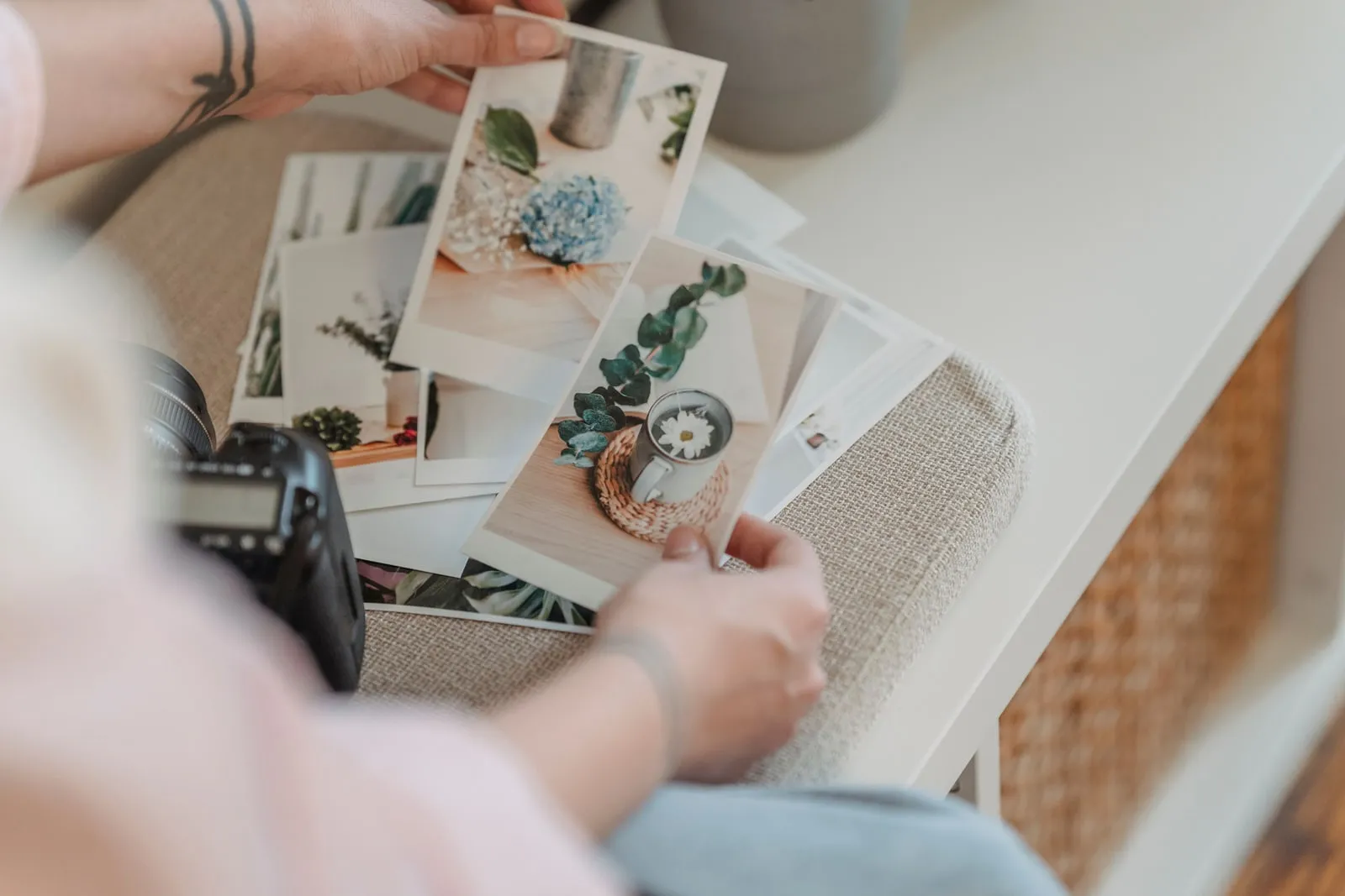 A photographer reviewing prints on a light table