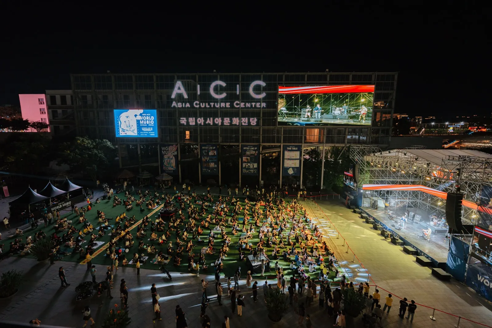 A large LED screen wall in a dark venue
