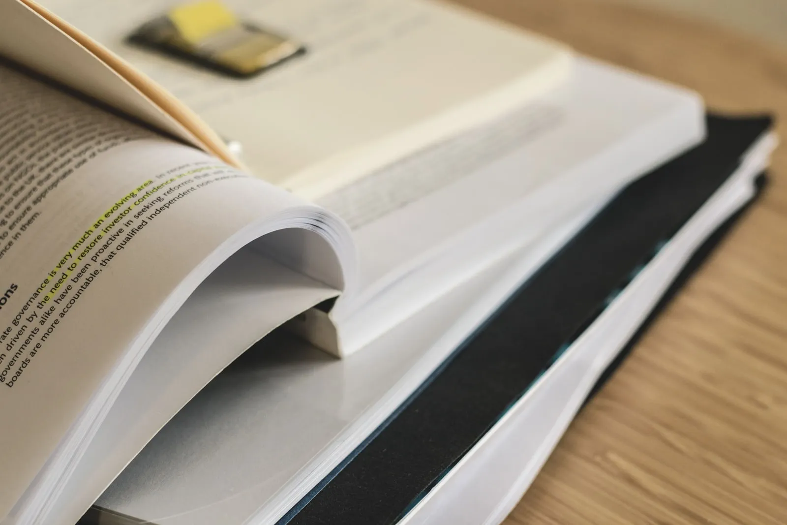 An open printed report with one line highlighted in yellow