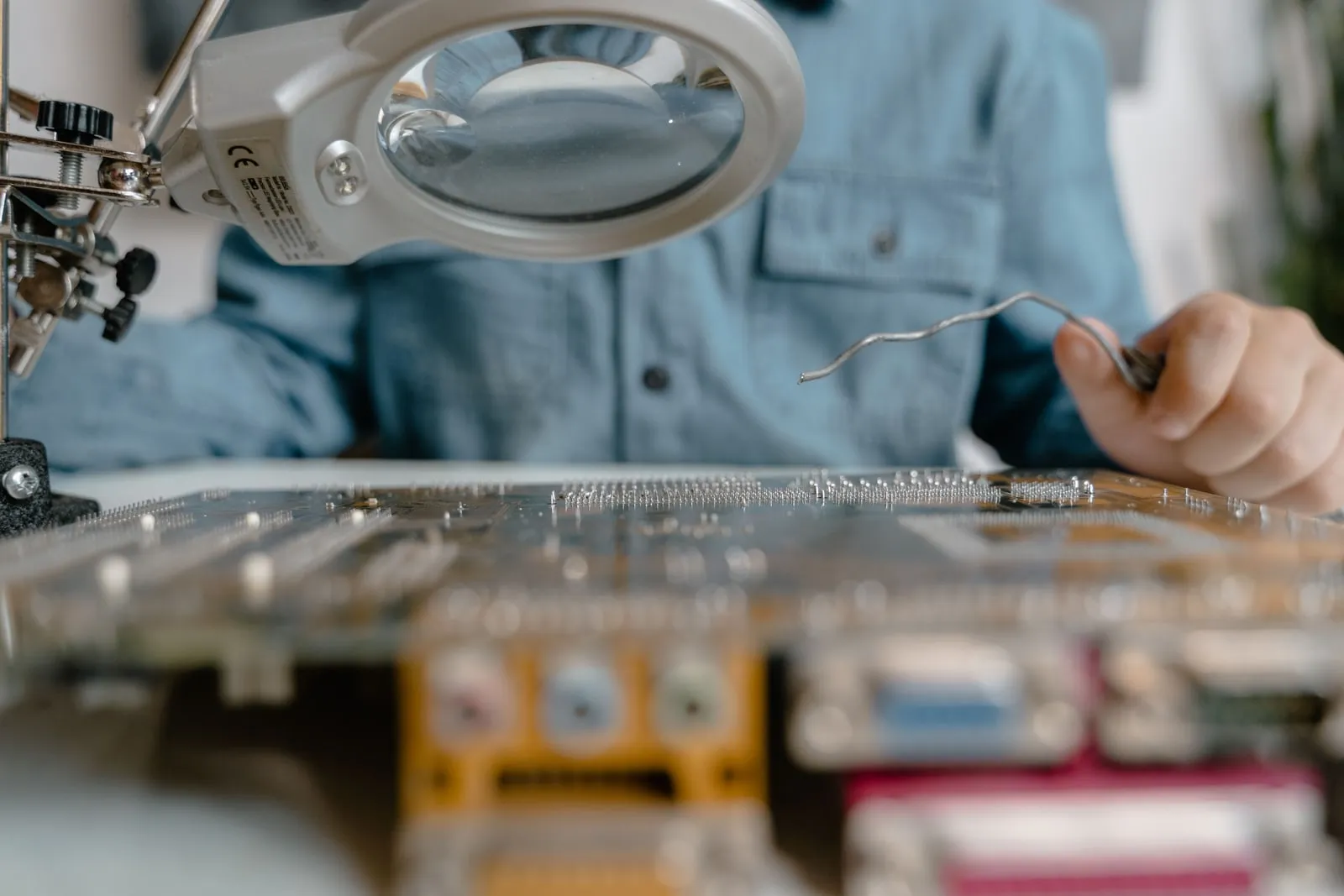 An engineer inspecting computer hardware on a workbench