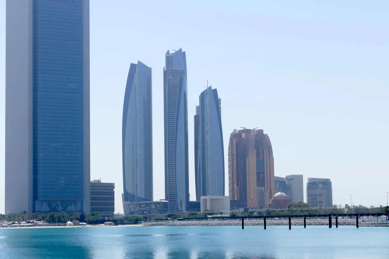 The skyline of Abu Dhabi with high-rise towers at dusk