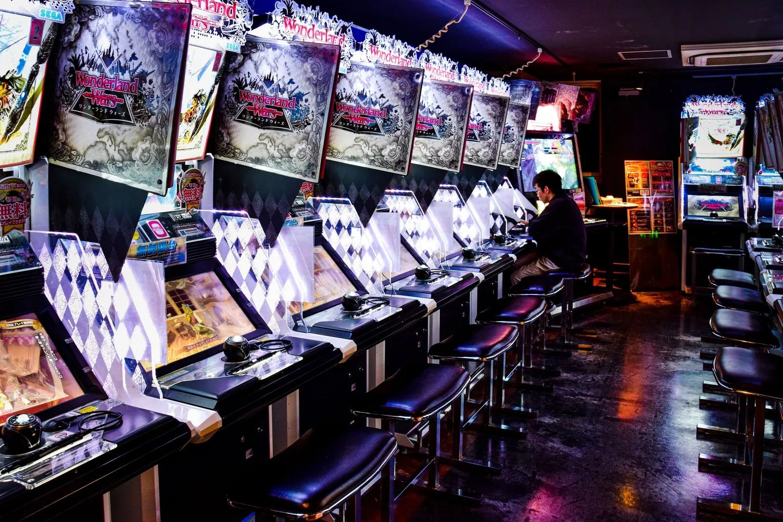 Colourful arcade machines lined up in a games arcade