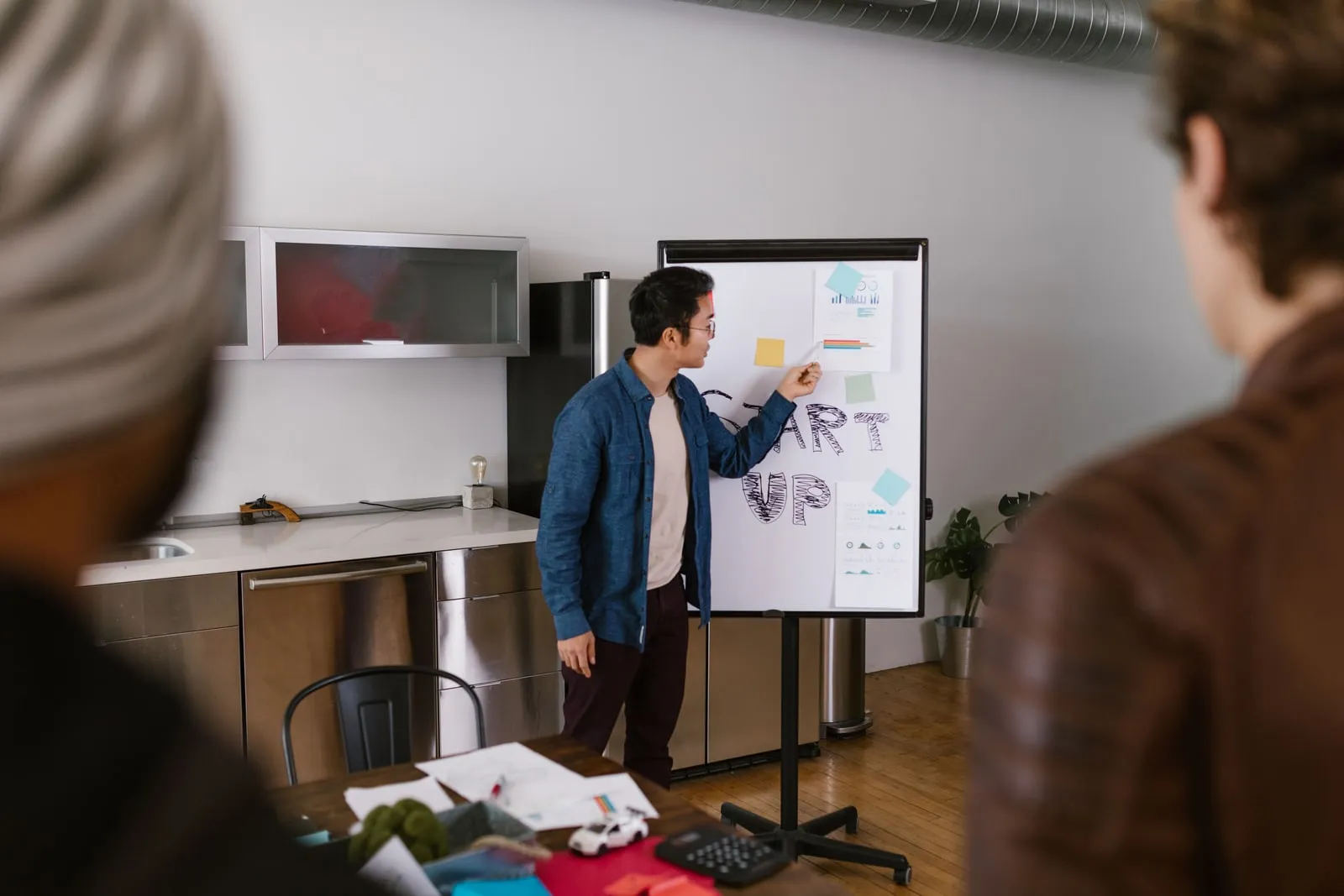 People in a meeting room looking at a presentation