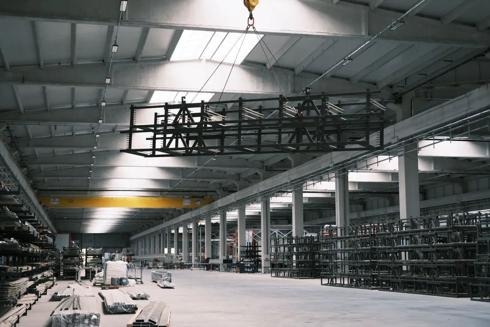 An overhead crane inside a large factory hall