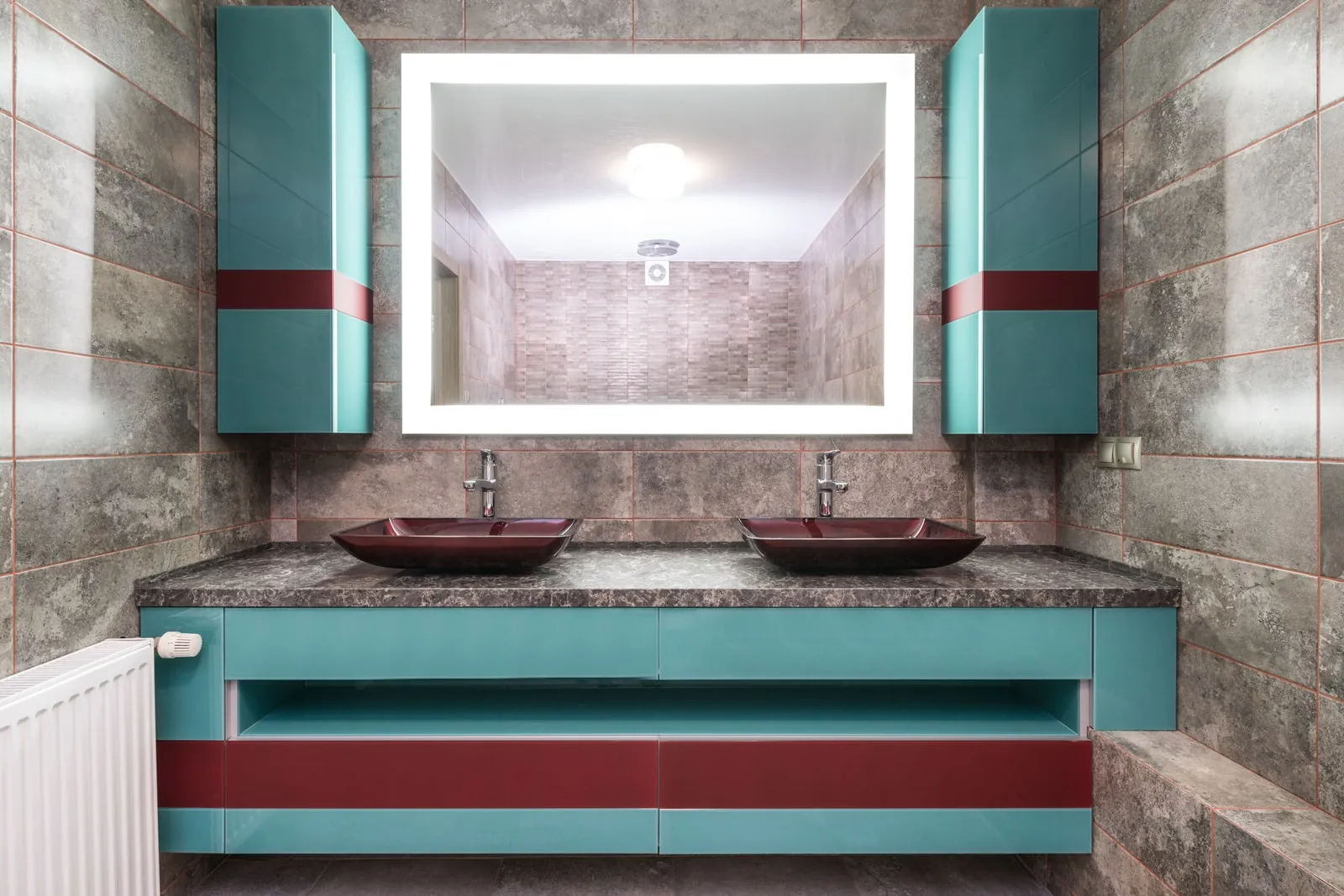 A bathroom mirror above a sink