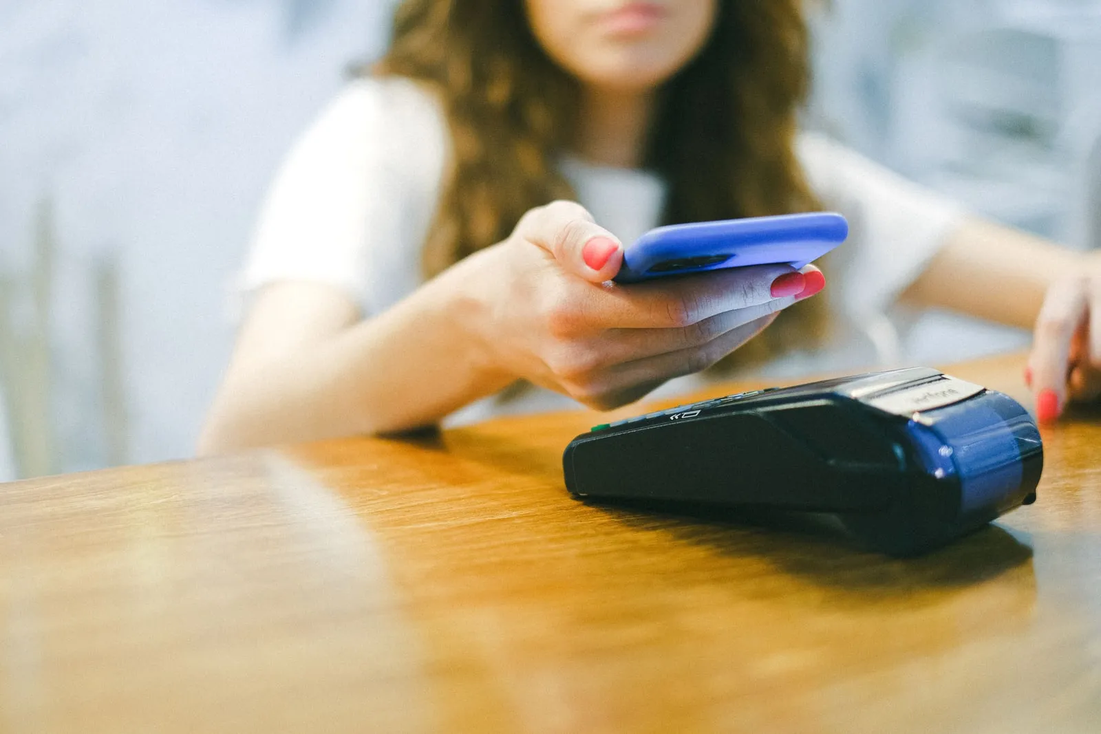 A person using a card payment terminal