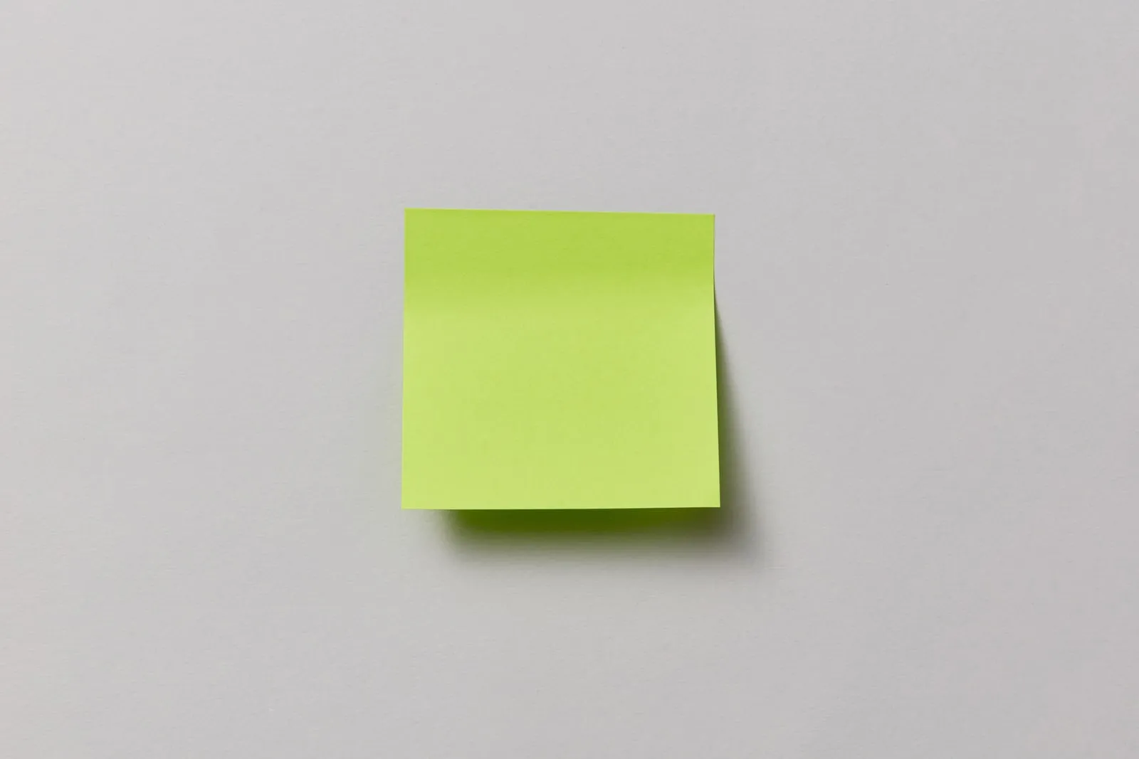 Blank sticky notes on a glass wall