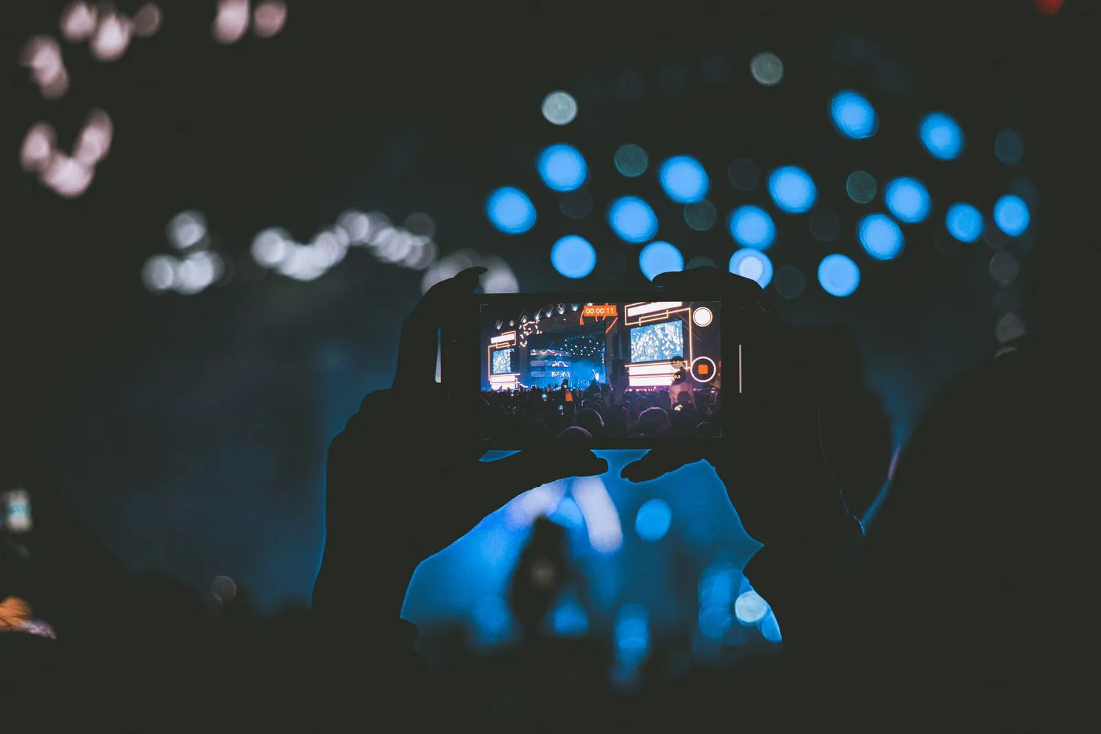 A person recording video with a phone