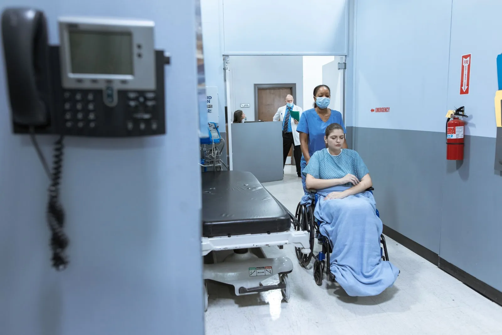 A hospital corridor with medical equipment