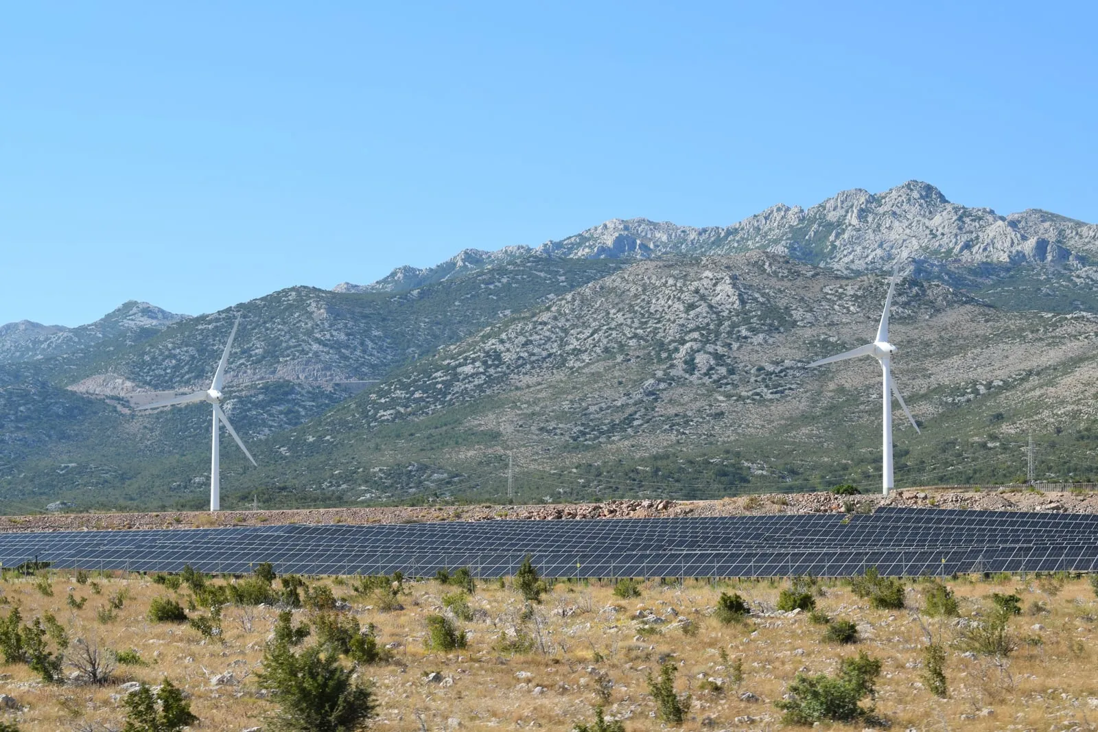 Wind turbines and solar panels in a landscape