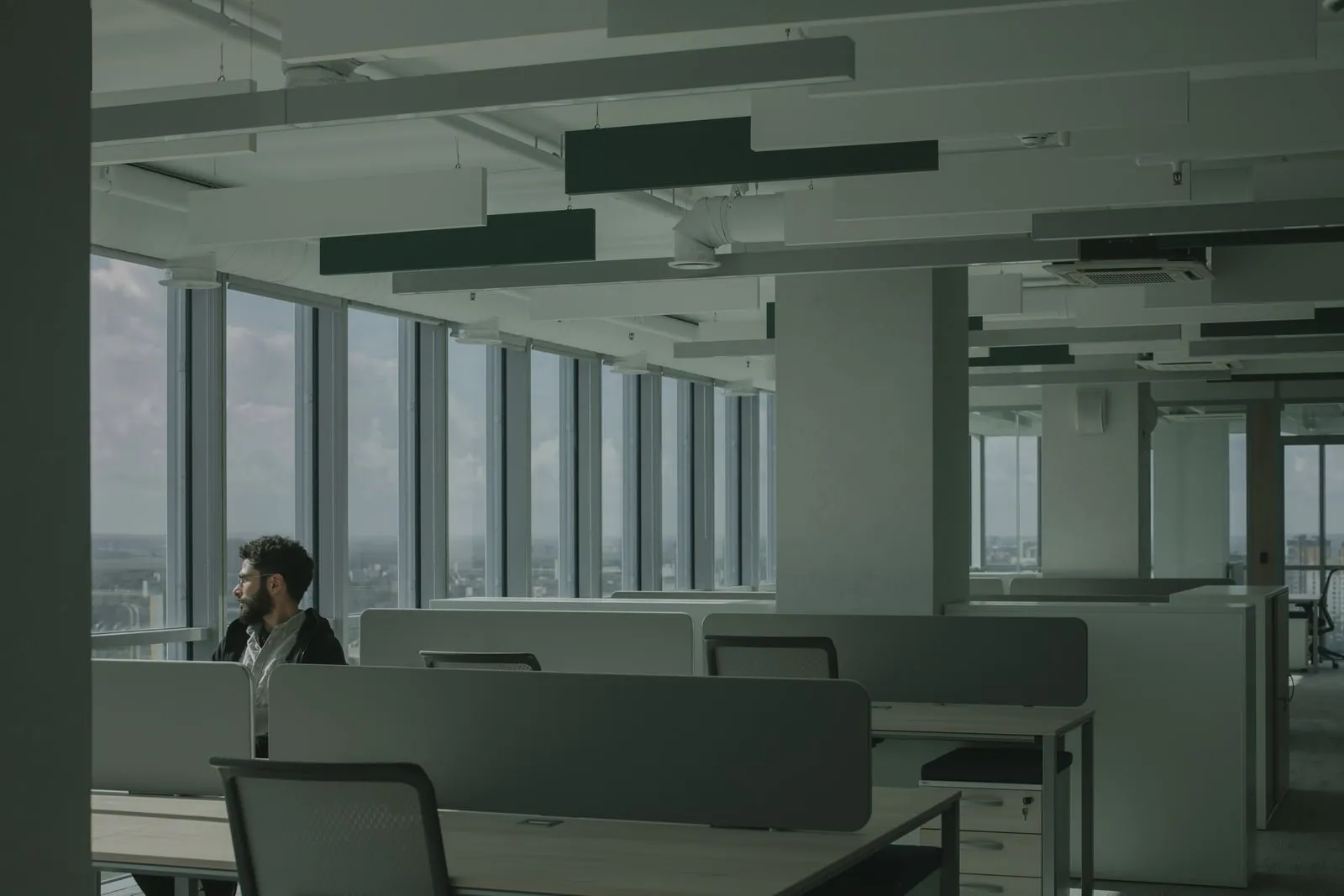 Office workers at desks on a corporate open plan floor