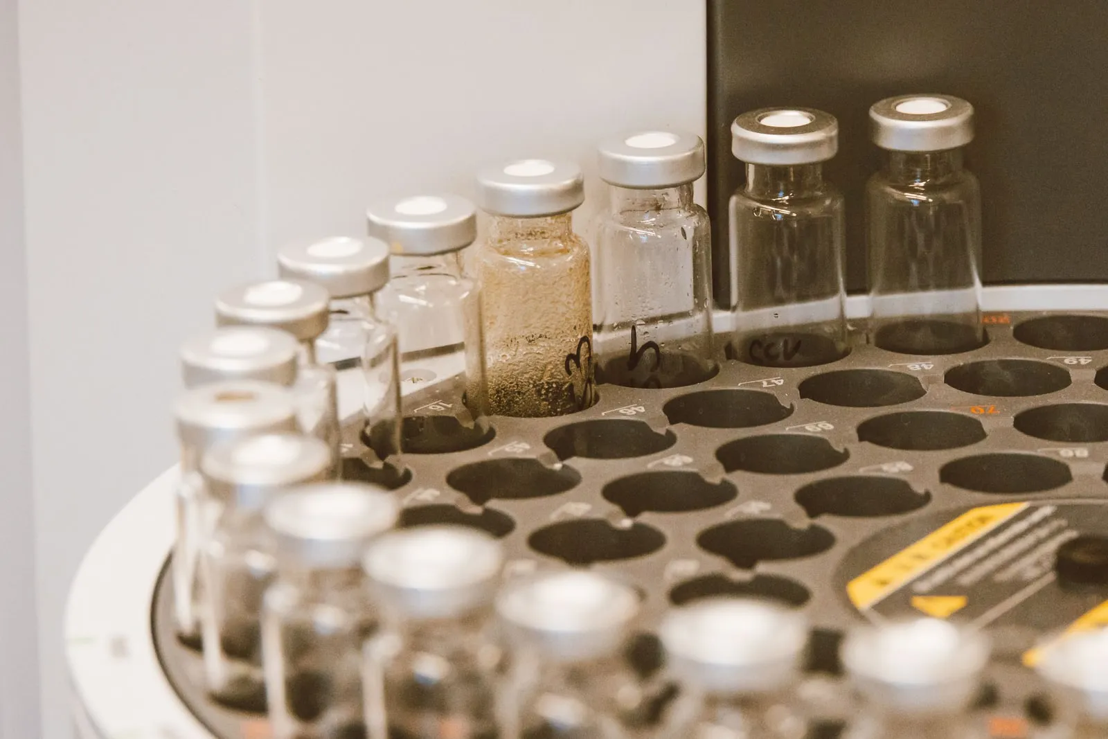 Laboratory freezer racks holding rows of sample vials