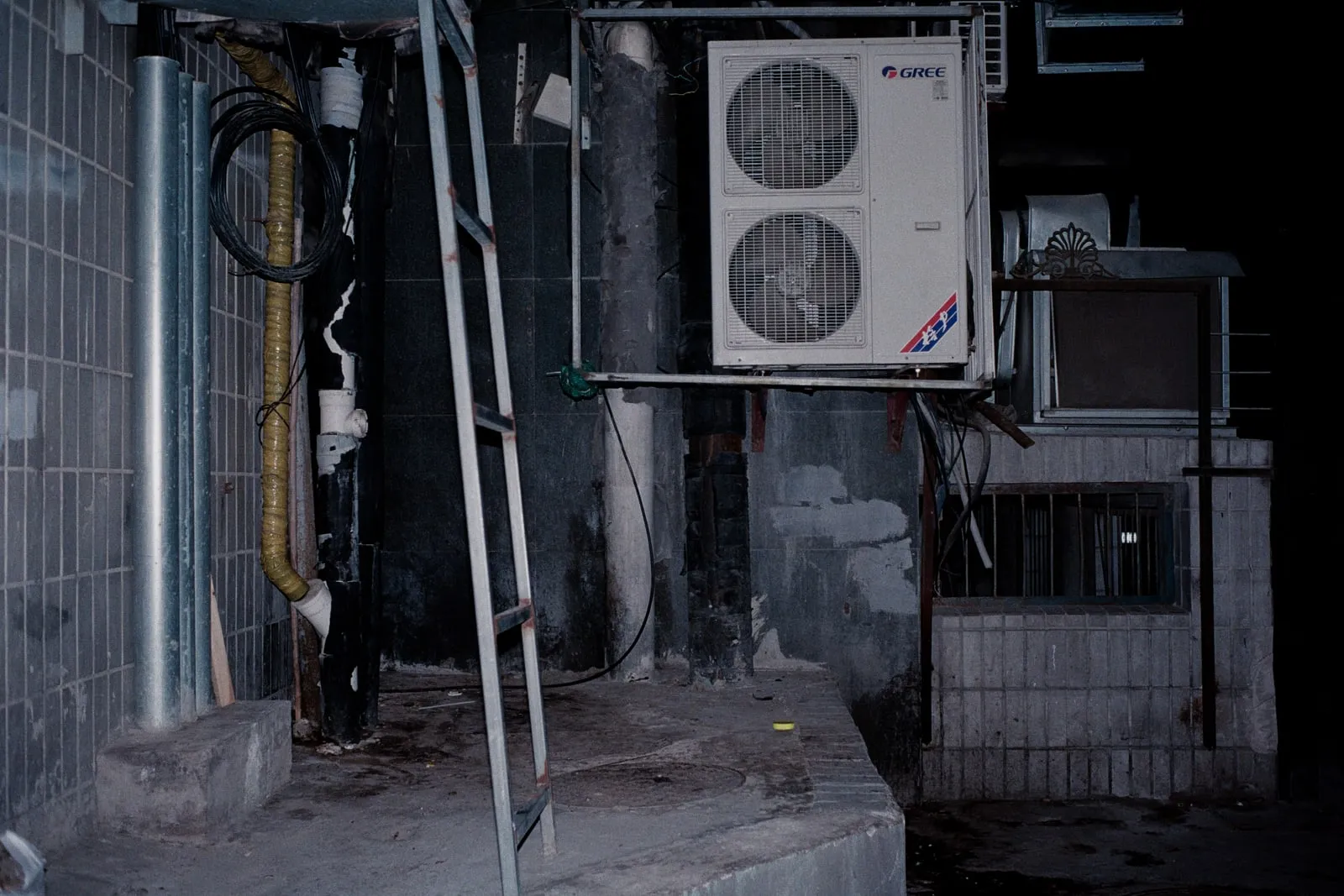 Large cooling pipes running through an industrial building