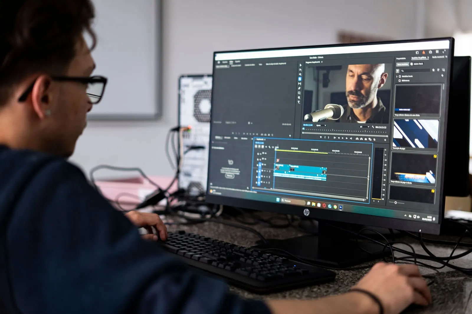 A person editing video footage on a computer screen
