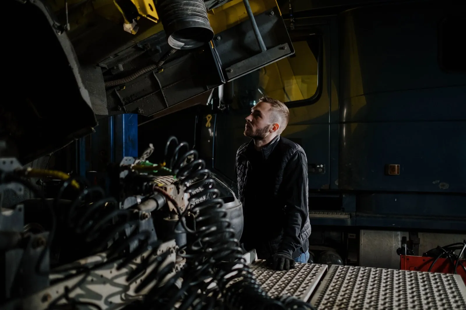 Engineers inspecting equipment in a workshop