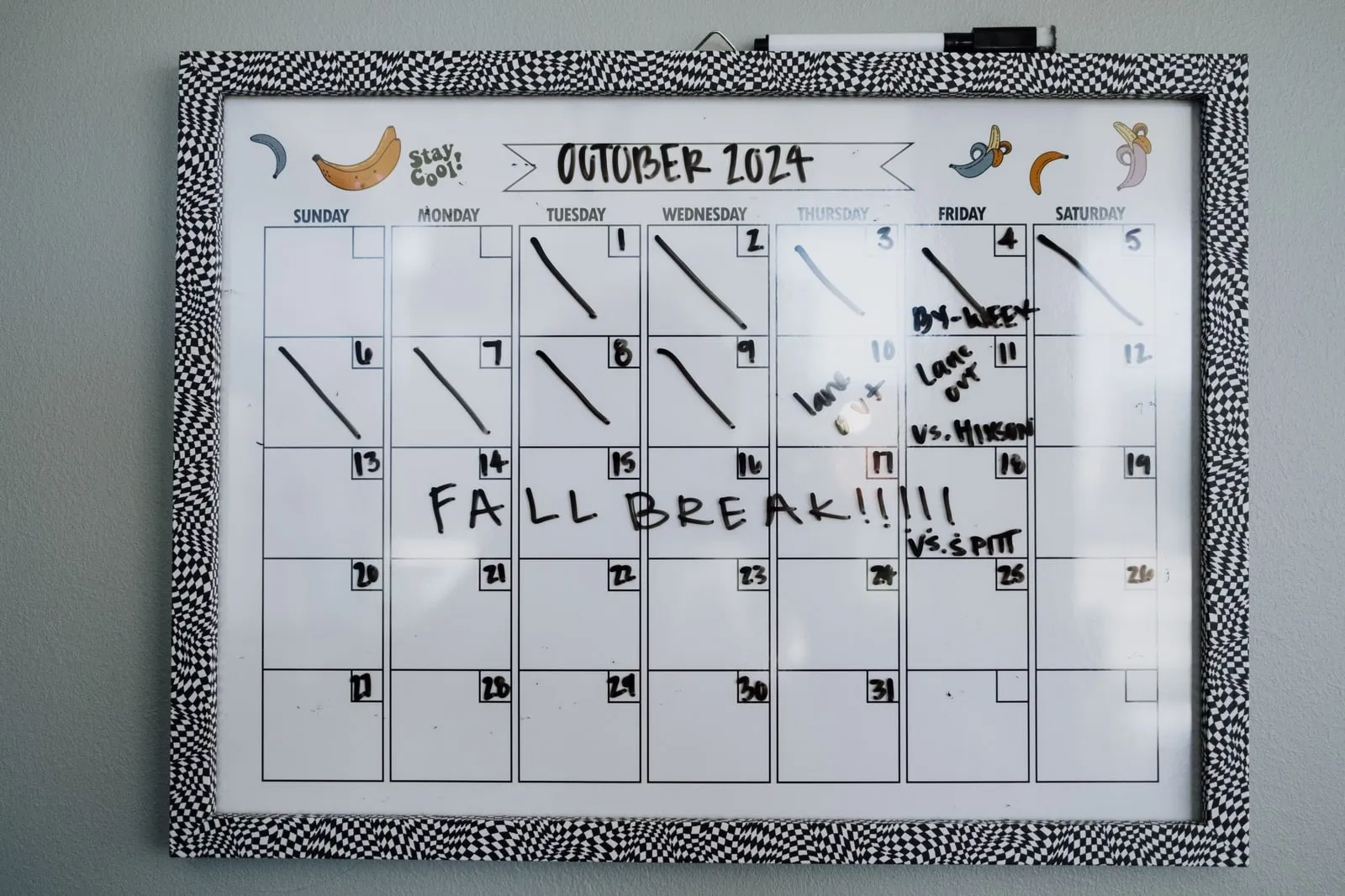 A wall calendar with dates marked
