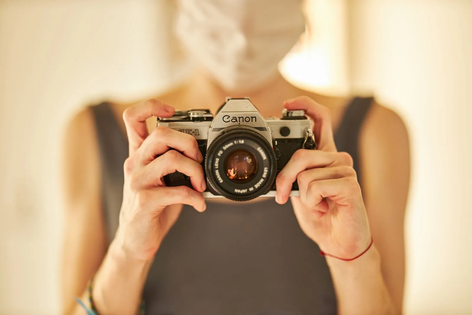 A person photographing the interior of a room with a camera.