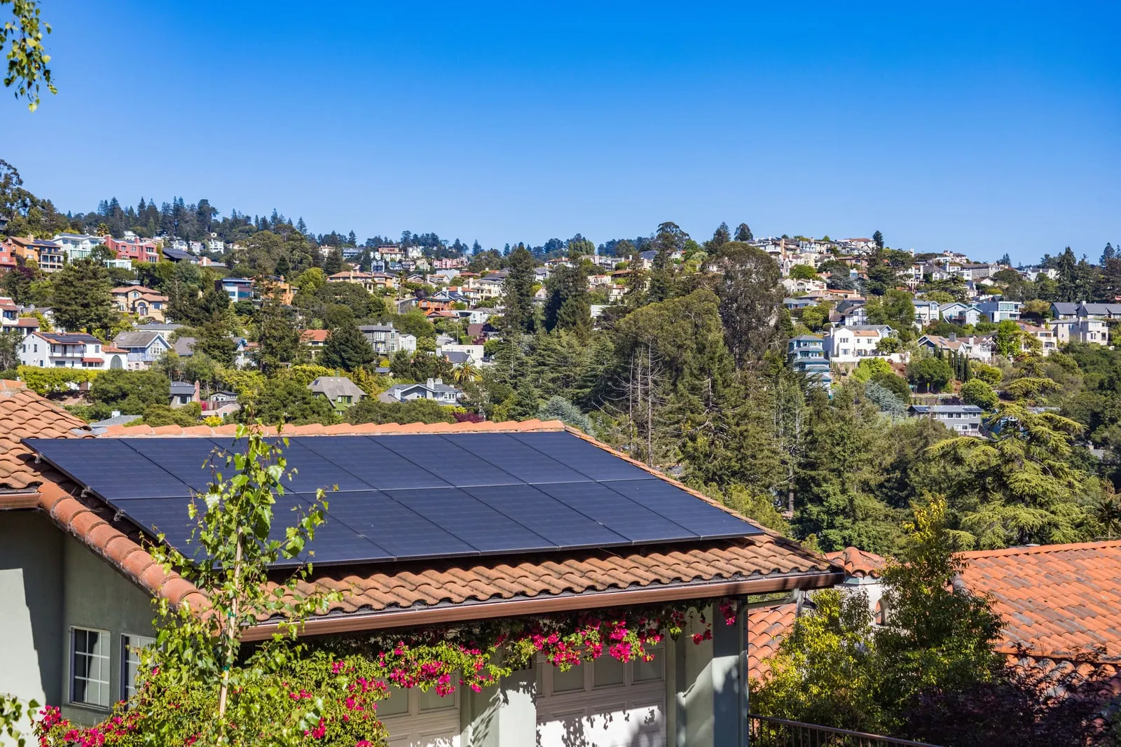 Solar panels fitted to the roof of a suburban house