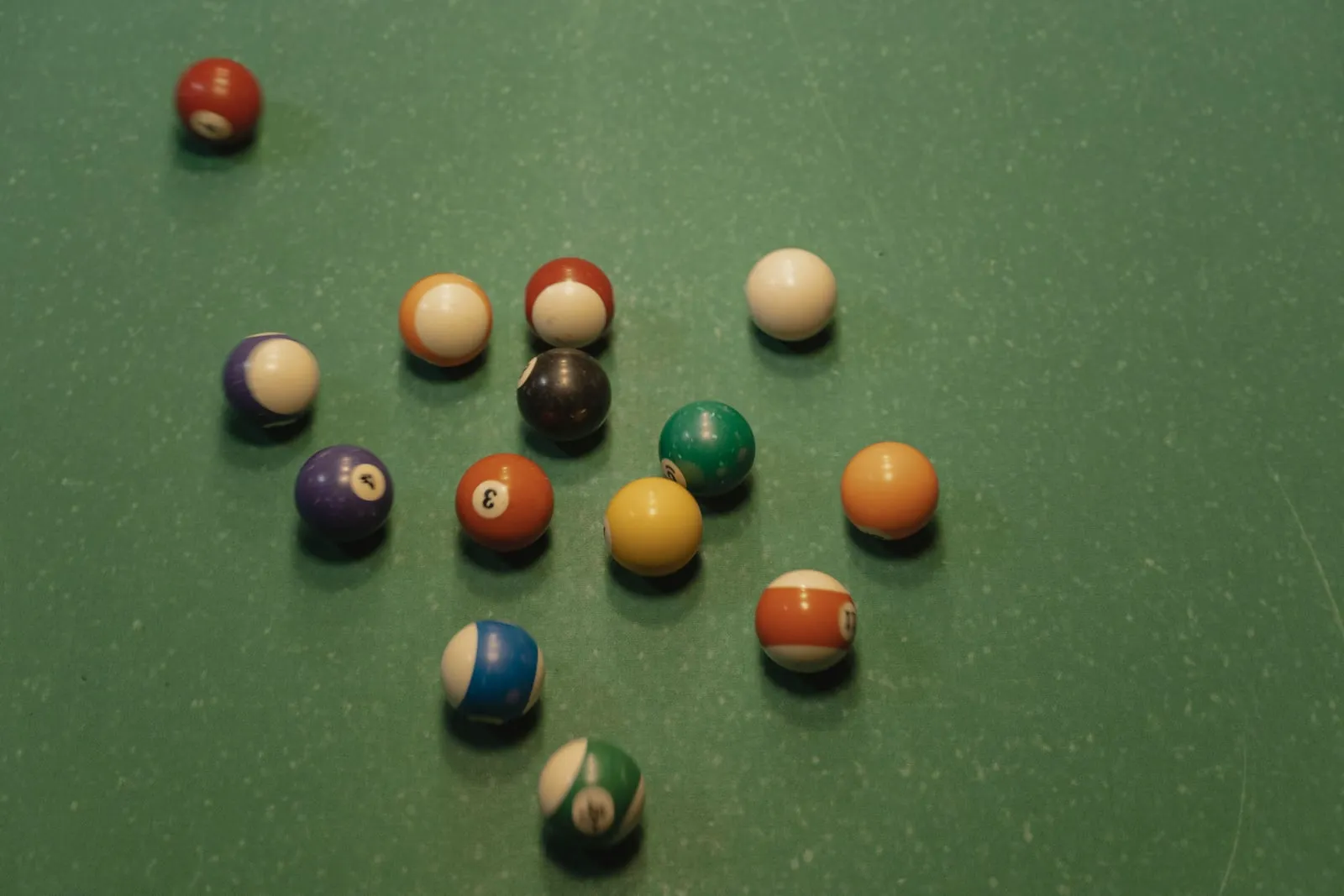 Billiard balls on a green table
